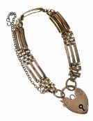 A 9ct gold child's gate bracelet with heart padlock clasp, 8.5g, 13cm