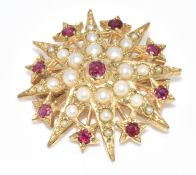 A 9ct gold brooch in the form of a star set with split pearls and rubies, 7.3g, 2.8cm