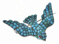 Victorian brooch in the form of a swallow set with turquoise cabochons and garnet eyes, verso