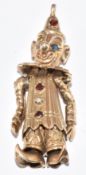 A 9ct gold pendant in the form of a clown set with spinel eyes, garnets and a pearl, 3.8cm, 7.9g