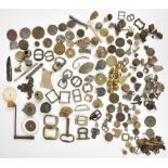 A large collection of metal detector finds and collectibles including badges, military buttons and