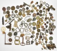 A large collection of metal detector finds and collectibles including badges, military buttons and