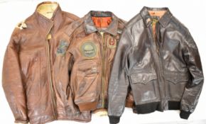 Three re-enactment leather full zip jackets comprising two US Air Force examples (XL) with patches