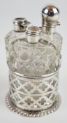 George V hallmarked silver miniature three bottle dressing table or condiment set, the pierced