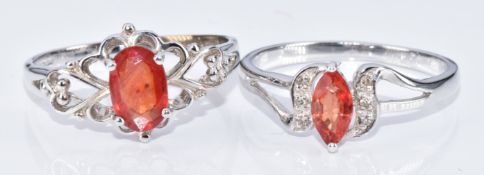 Two 9k white gold rings, one set with a marquise cut sunset sapphire and diamonds and the other an