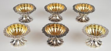 Set of six Georgian hallmarked silver pedestal open salts with decorative borders, lobed gilt wash