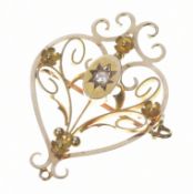 Edwardian 15ct gold pendant / brooch set with a diamond in a star setting, 2.8g, 2 x 3cm