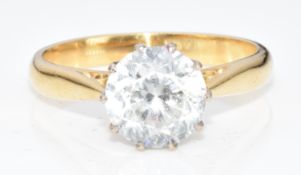An 18ct gold ring set with a white sapphire, 4.4g, size O
