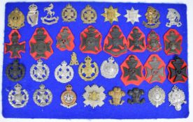 Thirty four cap badges and insignia, mostly London related, including 20th London Regiment, Artist's