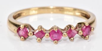 A 9ct gold ring set with a round cut and square cut rubies, 1.8g, size Q/R