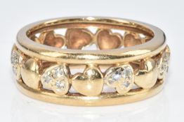 A 9ct gold ring with pierced heart decoration, five of the hearts set with diamonds (one diamond