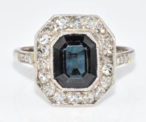 Art Deco 18ct white gold ring set with an emerald cut sapphire of approximately 1.2ct surrounded