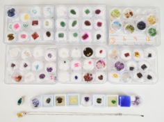 A collection of loose gemstones including topaz (3.5ct), oval cut amethyst (9.3ct), sunstone, two