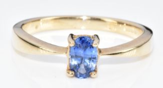 A 9ct gold ring set with an oval cut sapphire of approximately 0.45ct, 2.2g, size M