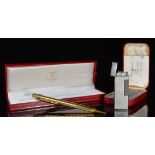 Cased Must de Cartier ballpoint pen and a cased silver plated Dunhill Rollagas lighter PLEASE NOTE