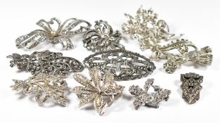 Five silver brooches and a silver clip, all set with marcasite (67g), two Exquisite brooches set