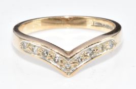 A 9ct gold 'V' shaped ring set with diamonds, 3g, size P