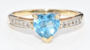 A 9ct gold ring set with a heart cut topaz and cubic zirconia, 2.1g, size N