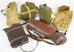 Militaria including three water canteens, some with covers, netting and leather carrier strap and
