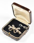 A c1920 silver brooch in the form of a bow set with baguette and round cut diamonds (5.7g, 4.3cm)