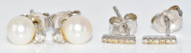 Two pairs of 9ct white gold earrings, one pair set with diamonds and the other a pearl and diamonds,