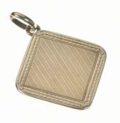 A c1900 yellow metal locket with engine turned and foliate decoration, 7.2g, 2.2cm (tests as 14k