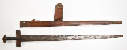 19thC North African Takouba, Tuareg tribal sword in tooled leather scabbard, length 95cm. PLEASE