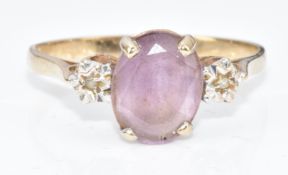 A 9ct gold ring set with an amethyst and diamonds, 1.6g, size N