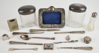 Silver items to include three hallmarked silver lidded cut glass dressing table pots, Hukin &