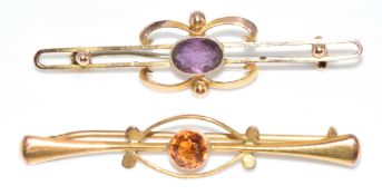Two 9ct gold brooches, one set with an oval cut amethyst and the other a citrine, 3.7g