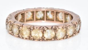 A 9ct eternity gold ring set with spinel, 3.4g, size N