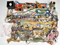 A collection of jewellery including lacquer brooches, necklaces including Erwin Pearl, silver,