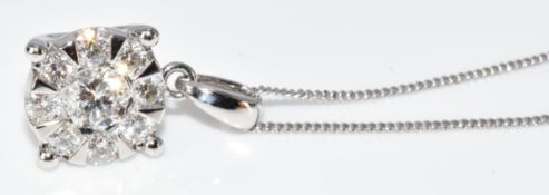 A 9ct white gold pendant set with round brilliant cut diamonds in a cluster, the total approximately