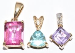 Three 9ct gold pendants set with amethyst and topaz, 4.4g