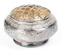 Indian, Burmese or similar silver bowl with embossed decoration and pierced cover, diameter 11.
