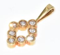 An 18ct gold pendant set with diamonds, 1.3g, 1.9cm