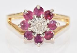 An 18ct gold ring set with a diamond surrounded by rubies in a cluster setting, 3.5g, size N