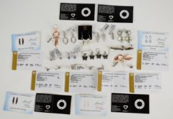 Thirteen pairs of silver earrings including sapphire, green amethyst, topaz, pearl, marcasite,