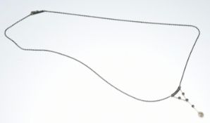 Belle Époque 9ct white gold necklace set with a natural pearl of approximately 5.3 x 6.2mm and