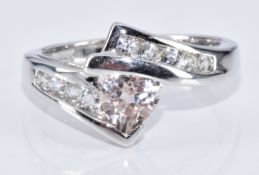A 9k white gold ring set with a trilliant cut morganite and topaz, with certificate, 4.4g, size N
