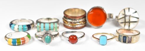 Nine silver rings including agate, mother of pearl, turquoise, etc and a 9ct gold and silver ring (