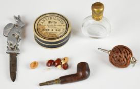 Two novelty propelling pipe and nut propelling pencils, golfing rabbit penknife, scent bottle and