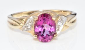 A 9ct gold ring set with an oval cut topaz, 2.9g, size N