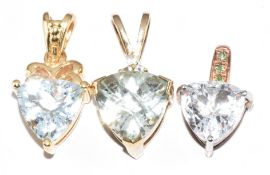 Three 9ct gold pendants set with topaz, 6.4g