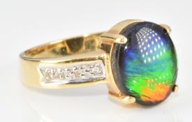 An 18ct gold ring set with an ammolite and diamonds, 5.1g, size Q