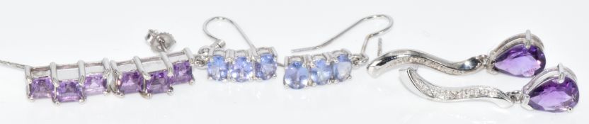 Three pairs of 9k white gold earrings comprising amethyst, diamond and amethyst and tanzanites, with
