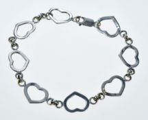 A 9ct white gold bracelet made up of heart shaped links, 4.4g, 19.5cm