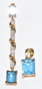 A 9ct gold pendant set with two emerald cut topaz and diamonds (3.7g, 5.2cm) and a 9ct gold