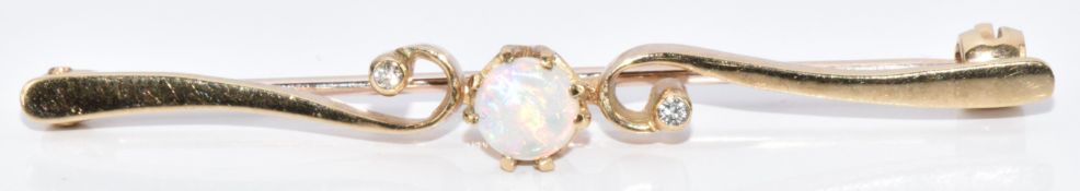 A 9ct gold bar brooch set with an opal and diamonds, 2.1g, 4.5cm