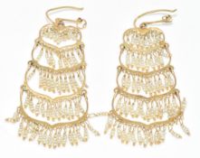 A pair of yellow metal earrings set with seed pearls, (test as 9k), 5.8g, 5cm